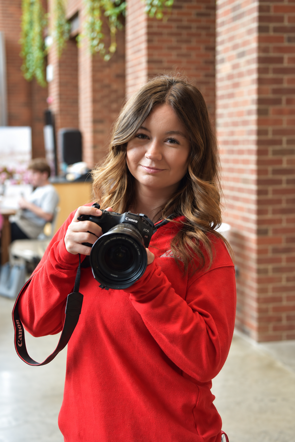 Emily holding her camera